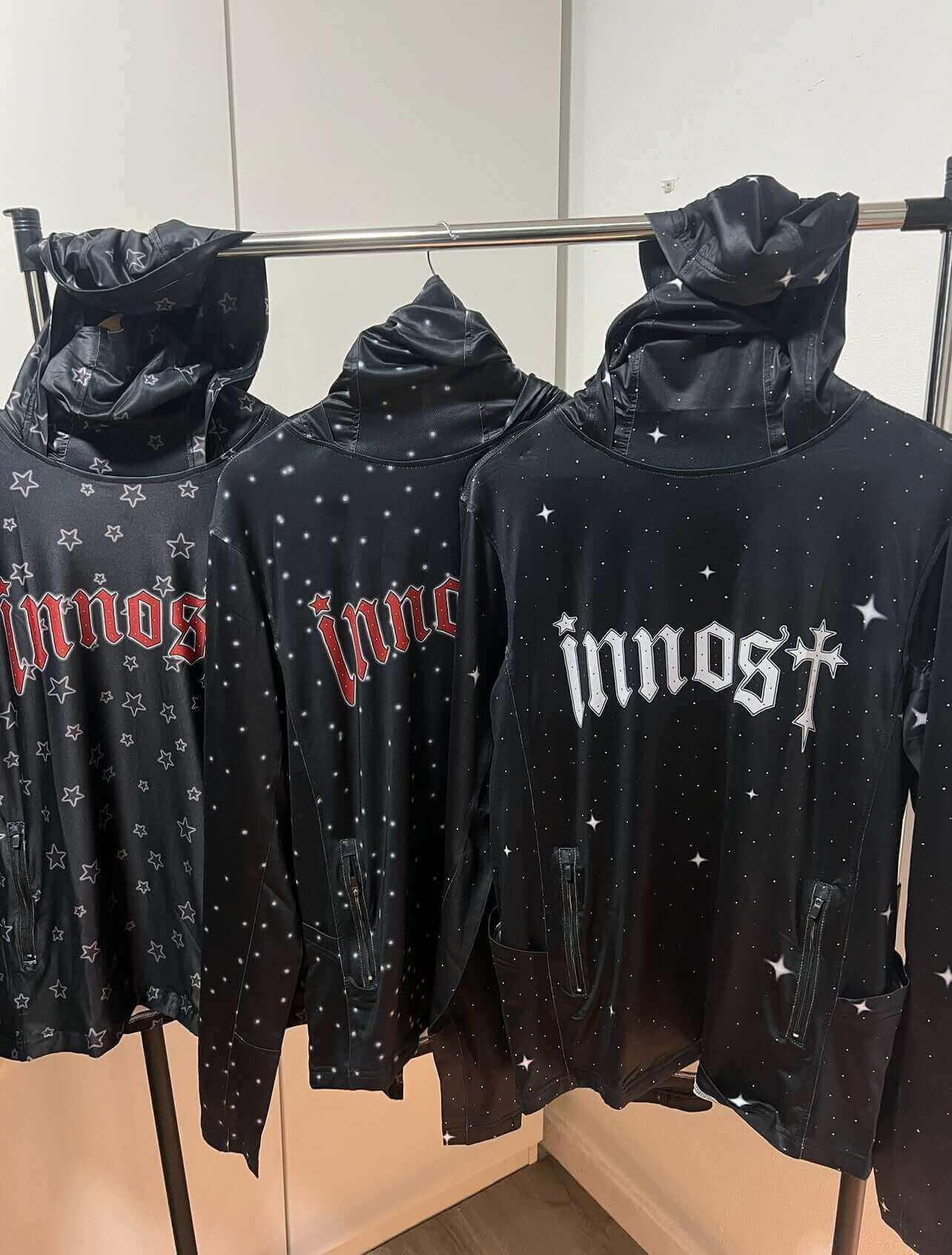 Display of Moon Dust hoodies, showcasing exclusive design, star pattern, and modern urban style.